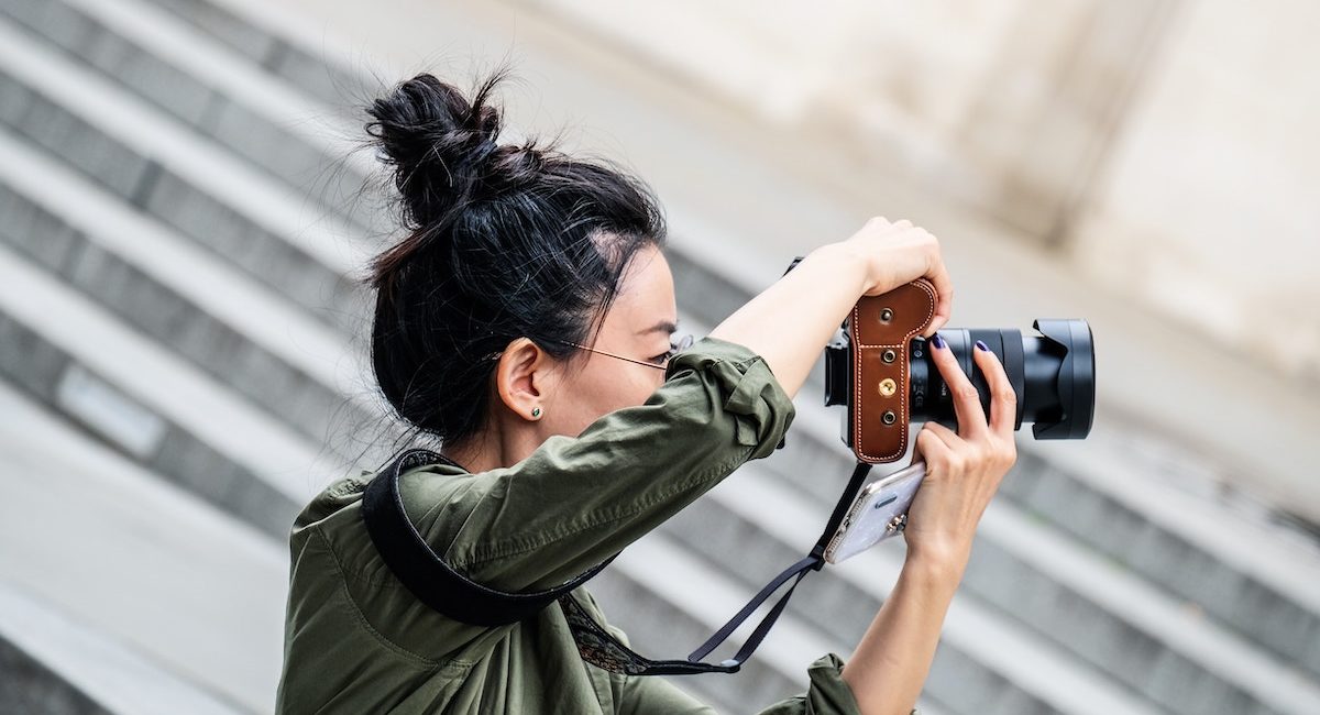 Woman taking a photo with a digital camera
